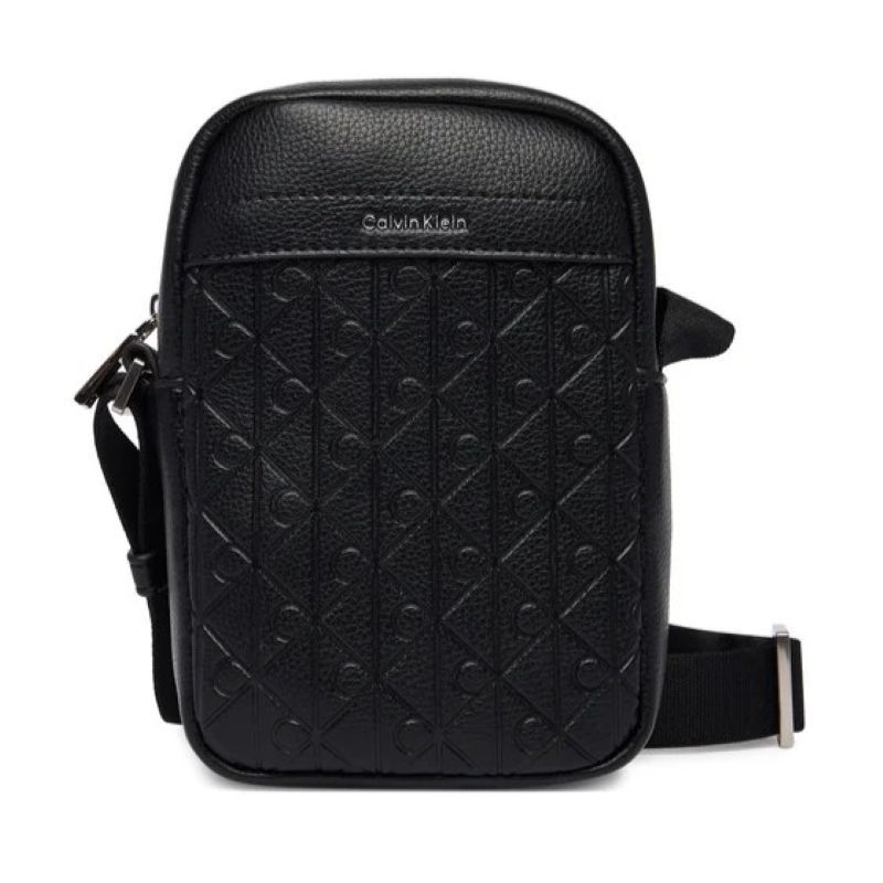 Borseta Calvin Klein EMBLEM AOP EMBOSS SLIM REPORTER